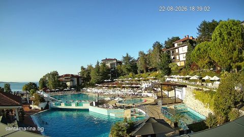 Live view of an outdoor pool and the adjoining leisure area